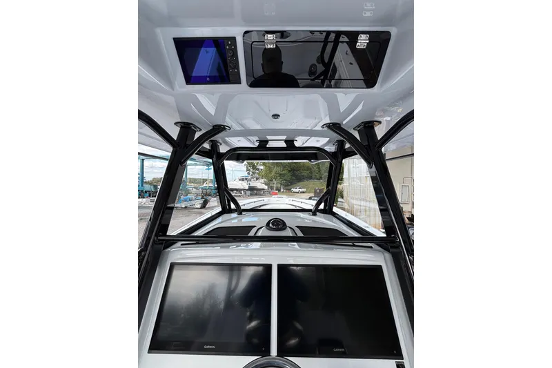 Slide: The Image of 2026 Yellowfin 39 Offshore boat cruising on open water, aerial view. - 11