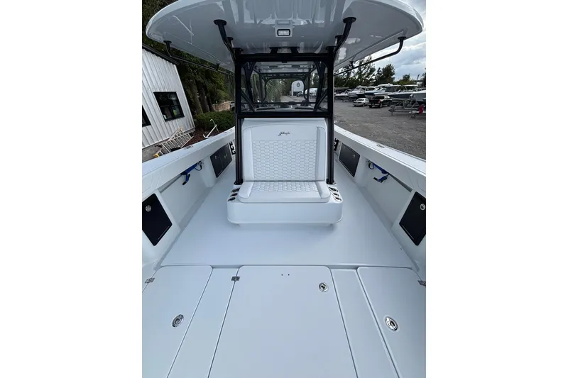 Slide: The Image of 2026 Yellowfin 39 Offshore boat with multiple outboard engines on turquoise water. - 12