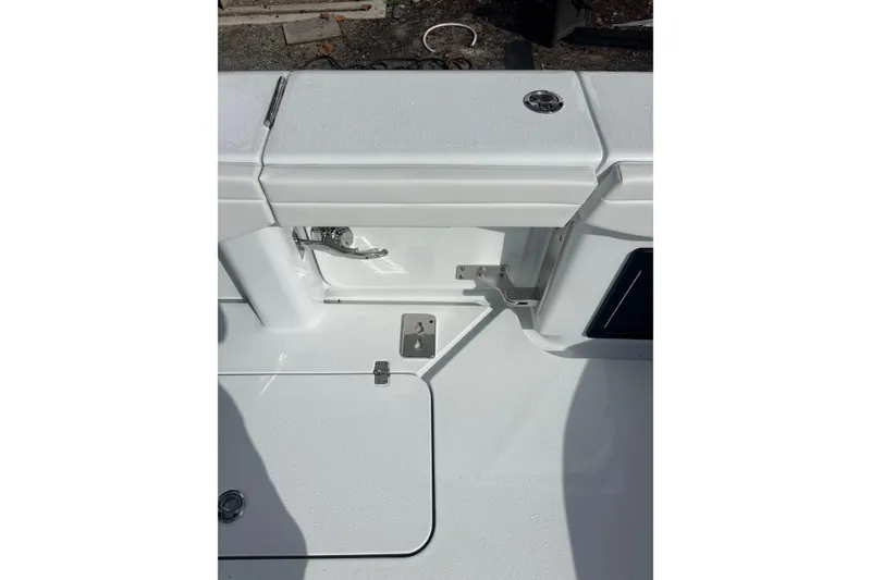 Slide: The Image of 2026 Yellowfin 39 Offshore boat cruising on a calm river near a residential area. - 17