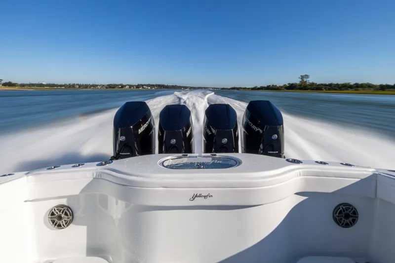 Slide: The Image of 2026 Yellowfin 39 Offshore boat speeding on water with four powerful Mercury engines. - 22