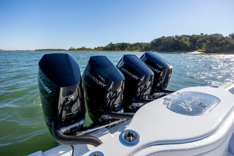 Slide: The Image of 2026 Yellowfin 39 Offshore boat with four Mercury outboard engines on a sunny day. - 23