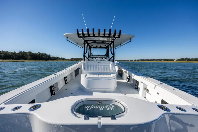 Slide: The Image of 2026 Yellowfin 39 Offshore boat on water, clear sky, spacious deck. - 24