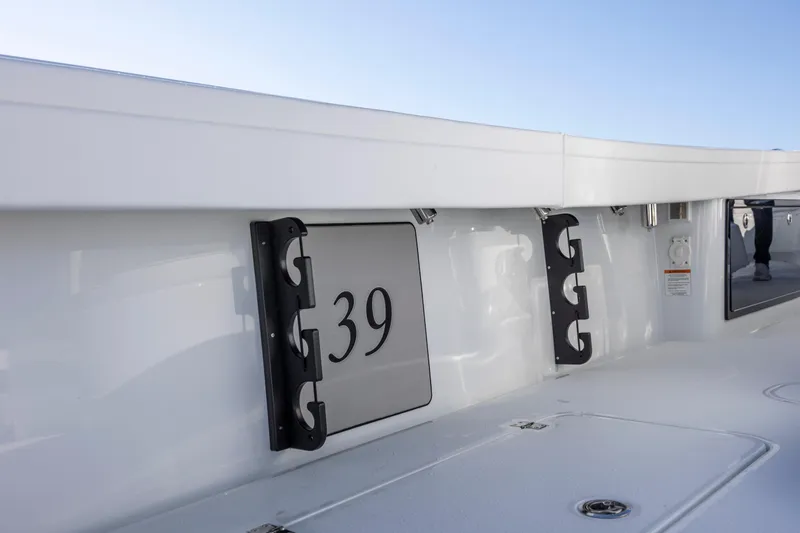 Slide: The Image of 2026 Yellowfin 39 Offshore boat interior with rod holders and sleek design. - 29
