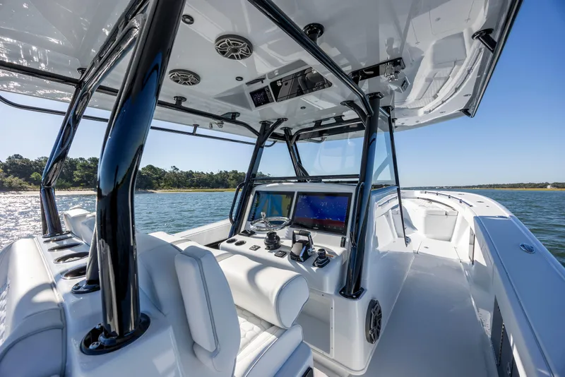 Slide: The Image of 2026 Yellowfin 39 Offshore boat interior with advanced navigation system on open water. - 31