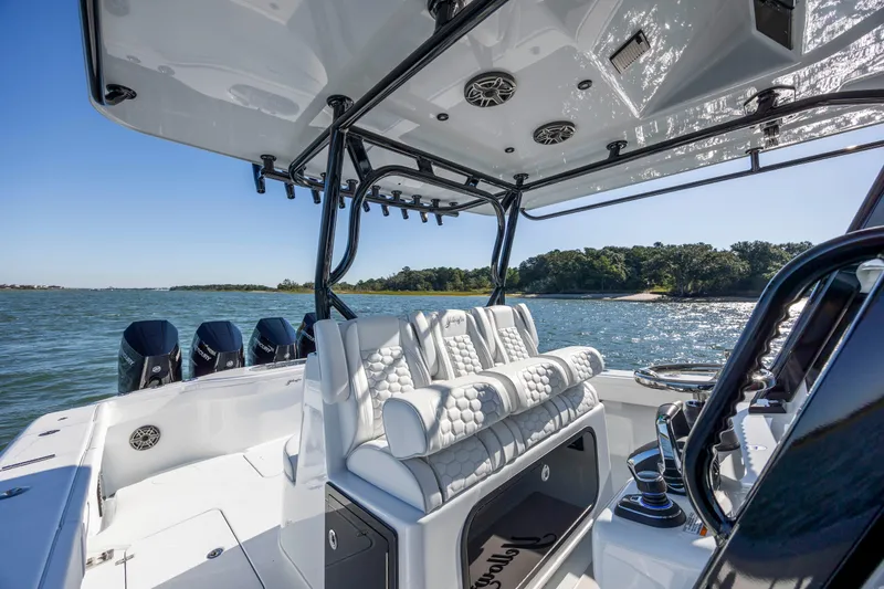 Slide: The Image of 2026 Yellowfin 39 Offshore boat interior with luxurious seating and multiple outboard engines. - 34