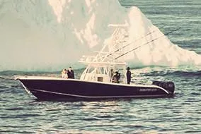 Slide: The Image of 2026 Yellowfin 39 Offshore boat cruising on water with powerful engines. - 5