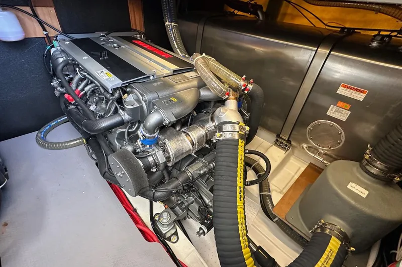 Slide: The Image of Engine room of 2024 Beneteau Swift Trawler 41 Sedan, showcasing detailed mechanical components. - 75