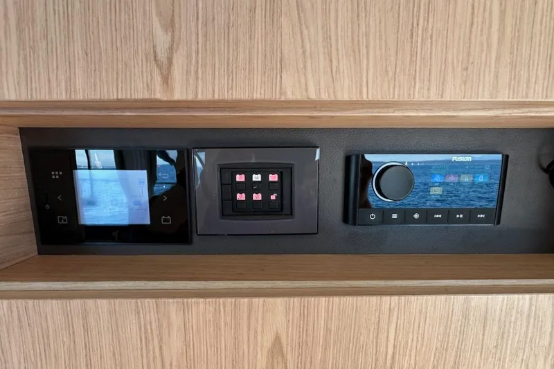 Slide: The Image of Control panel of 2024 Beneteau Swift Trawler 41 Sedan with touchscreen and audio system. - 78