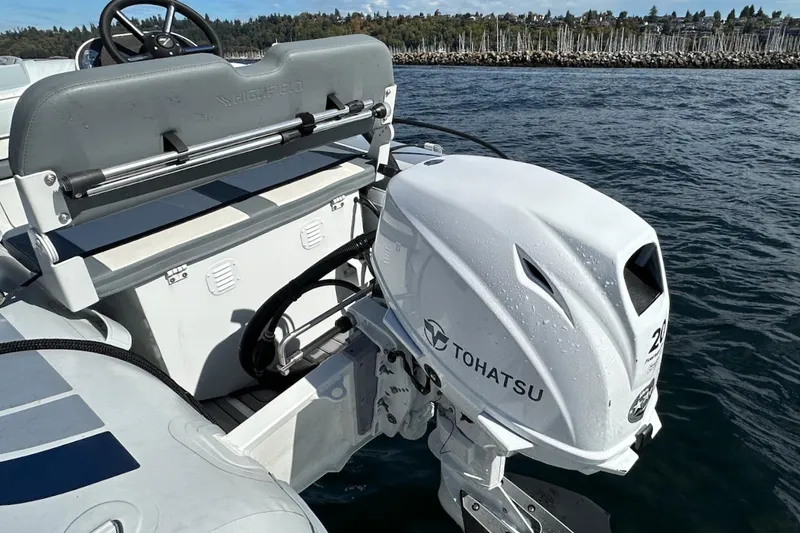 Slide: The Image of 2024 Beneteau Swift Trawler 41 Sedan with Tohatsu outboard motor on water. - 83
