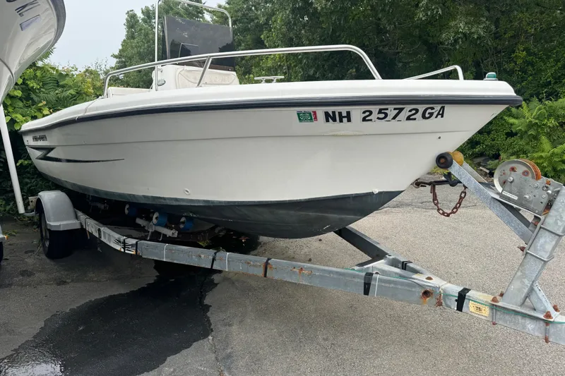 The Image of 2000 Hydra-Sports 180 Seahorse CC boat on trailer, parked outdoors. - 1