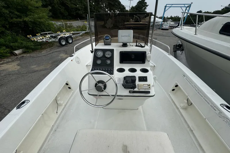 Slide: The Image of 2000 Hydra-Sports 180 Seahorse CC boat interior with steering wheel and control panel. - 10