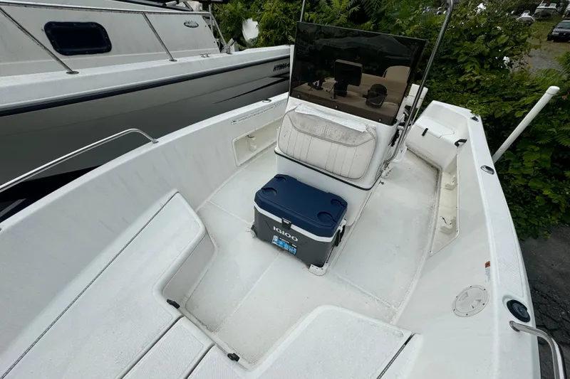 Slide: The Image of 2000 Hydra-Sports 180 Seahorse CC boat interior with seating and cooler. - 3