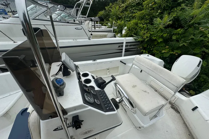 Slide: The Image of 2000 Hydra-Sports 180 Seahorse CC boat interior with control panel and seating. - 4