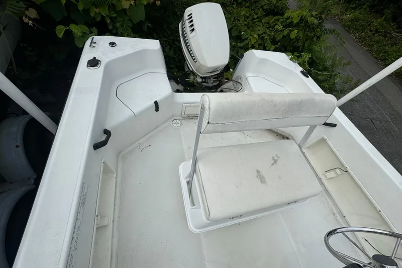 Slide: The Image of 2000 Hydra-Sports 180 Seahorse CC boat interior with seating and outboard motor. - 8