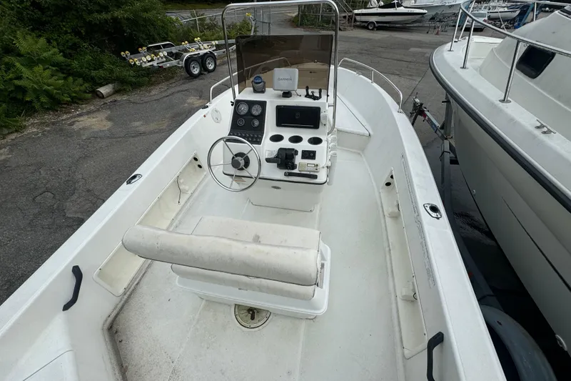 Slide: The Image of 2000 Hydra-Sports 180 Seahorse CC boat interior with steering console and seating. - 9