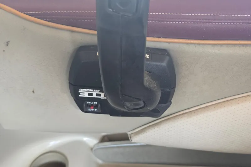 Slide: The Image of Quicksilver 3000 throttle control in a 1995 Maxum 2300 SC boat interior. - 10