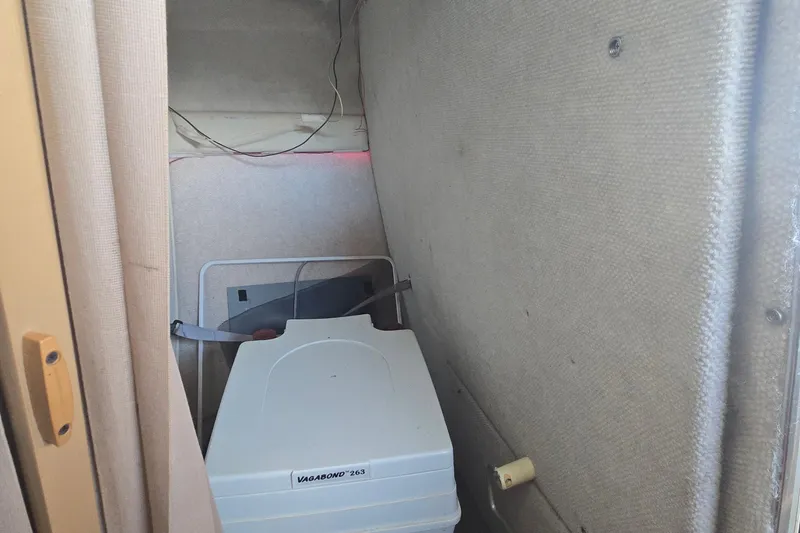 Slide: The Image of Interior of a 1995 Maxum 2300 SC boat with a Vagabond 263 portable toilet. - 20