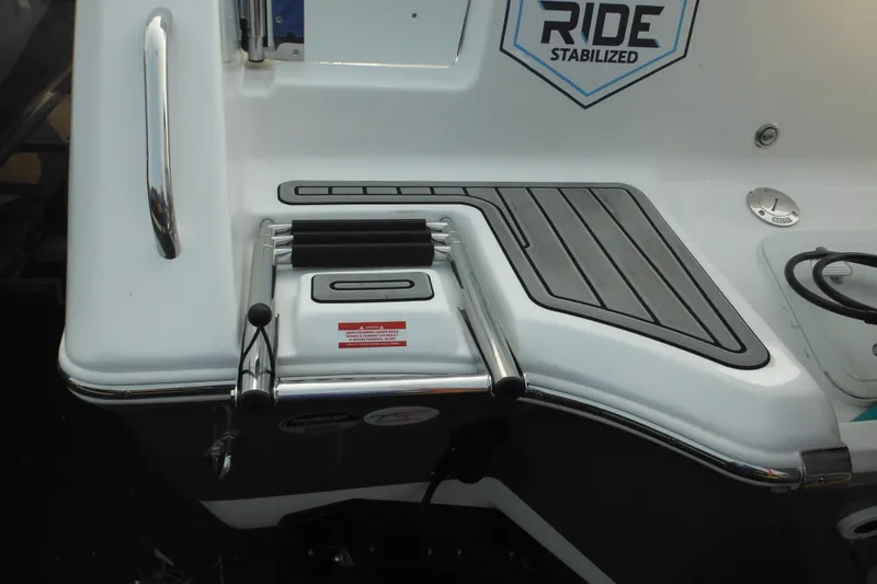 Slide: The Image of 2026 Tidewater 232 LXF boat with RIDE Stabilized feature and swim platform ladder. - 11