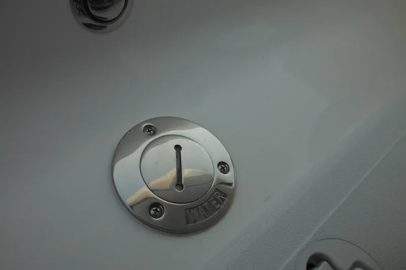 Slide: The Image of 2026 Tidewater 232 LXF boat water fill cap, stainless steel detail. - 13