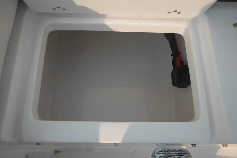 Slide: The Image of Open storage compartment in 2026 Tidewater 232 LXF boat. - 18