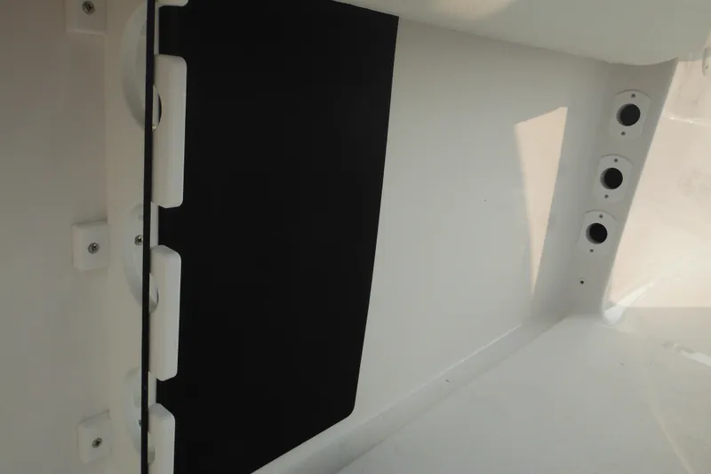 Slide: The Image of Interior view of 2026 Tidewater 232 LXF boat, featuring sleek white and black design. - 21