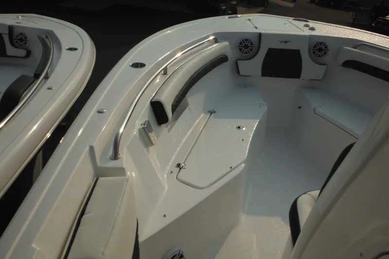 Slide: The Image of 2026 Tidewater 232 LXF boat interior with seating and speakers. - 25