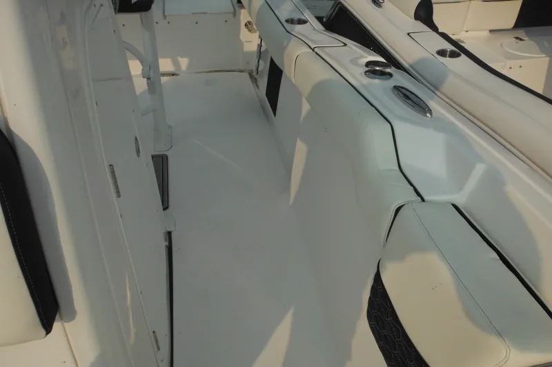 Slide: The Image of Interior view of 2026 Tidewater 232 LXF boat, featuring sleek seating and cup holders. - 29