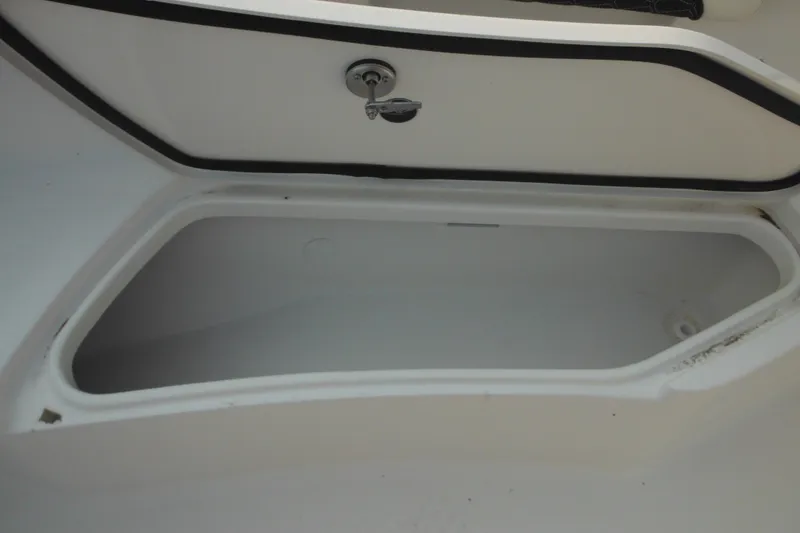 Slide: The Image of Storage compartment of 2026 Tidewater 232 LXF boat, open and empty. - 32