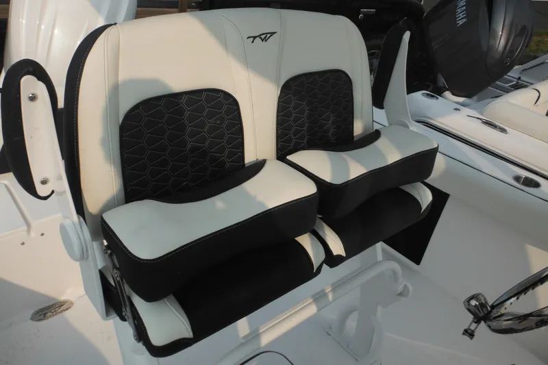 Slide: The Image of 2026 Tidewater 232 LXF boat seats with black and white cushioned design. - 39