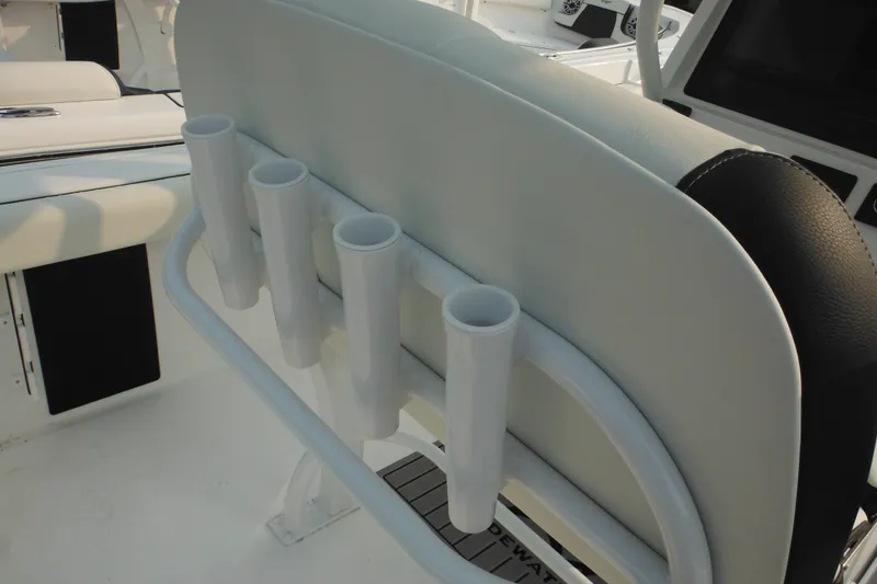 Slide: The Image of 2026 Tidewater 232 LXF boat seat with integrated rod holders. - 43