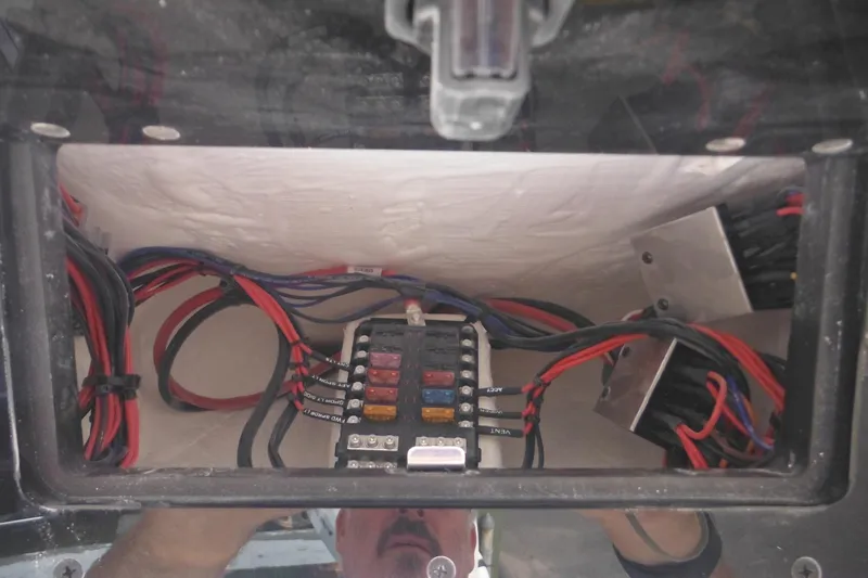 Slide: The Image of Electrical wiring and fuse box inside 2026 Tidewater 232 LXF boat. - 55