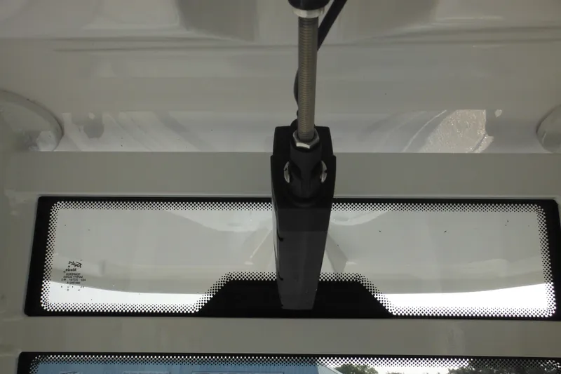 Slide: The Image of Close-up of 2026 Tidewater 232 LXF boat windshield wiper mechanism. - 56
