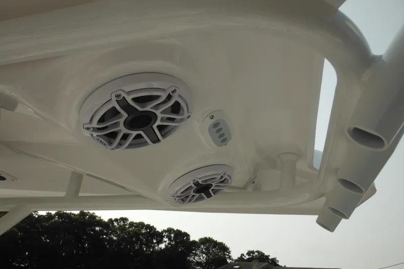 Slide: The Image of 2026 Tidewater 232 LXF boat speakers and rod holders on T-top. - 57