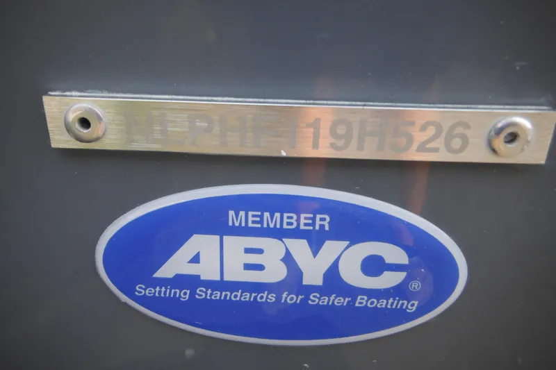 Slide: The Image of ABYC member plaque on 2026 Tidewater 232 LXF boat, promoting safer boating standards. - 7