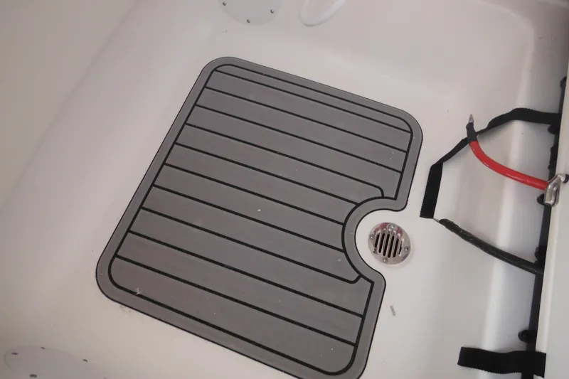 Slide: The Image of 2026 Tidewater 232 LXF boat deck with drain and wiring. - 74