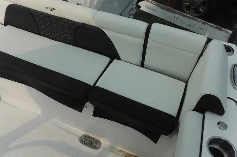 Slide: The Image of 2026 Tidewater 232 LXF boat seating with black and white upholstery. - 76