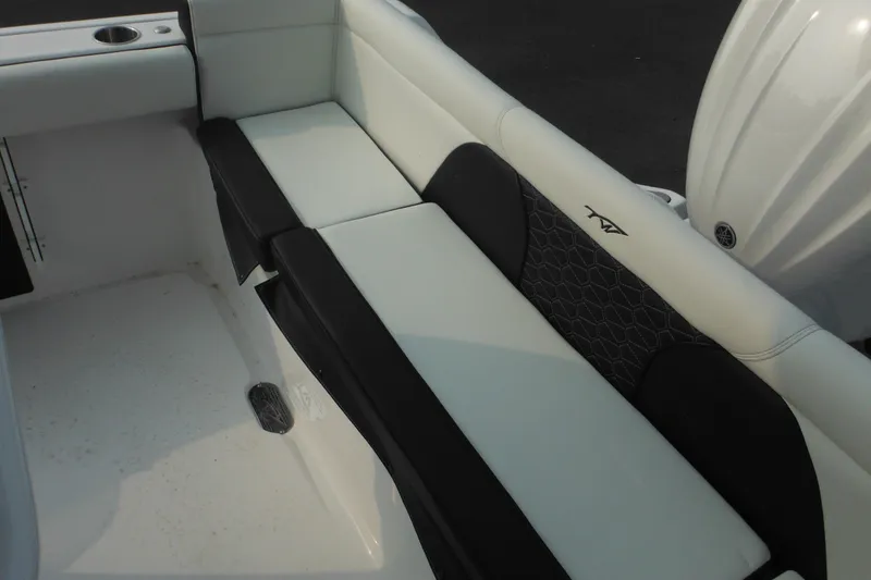 Slide: The Image of 2026 Tidewater 232 LXF boat interior seating with black and white upholstery. - 77