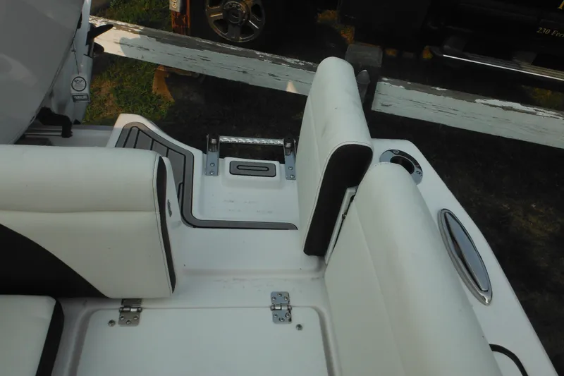 Slide: The Image of 2026 Tidewater 232 LXF boat interior with white seating and cup holders. - 78