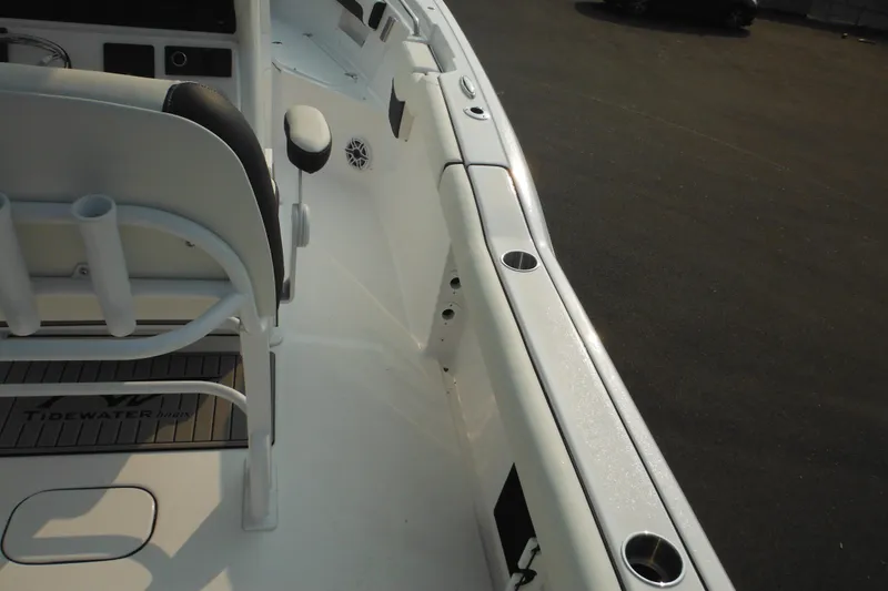 Slide: The Image of 2026 Tidewater 232 LXF boat interior with seating and rod holders. - 82