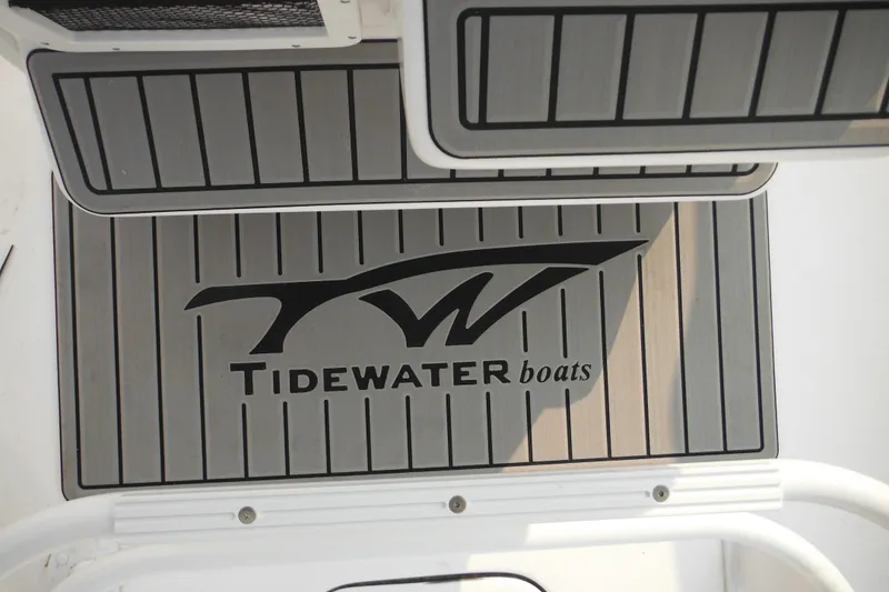 Slide: The Image of Tidewater 232 LXF 2026 boat deck with logo and sleek design. - 84