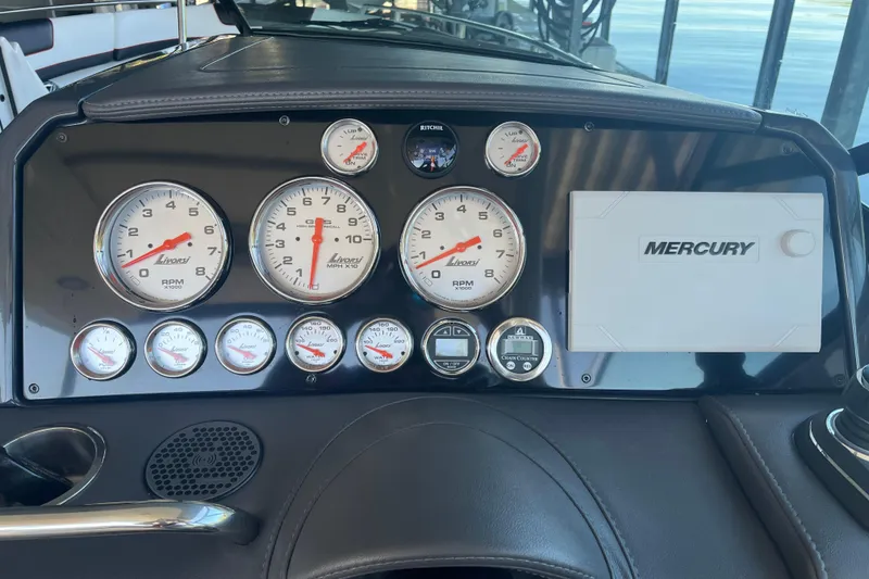 Slide: The Image of Dashboard of 2021 Formula 310 Bowrider I/O with Mercury gauges and controls. - 10
