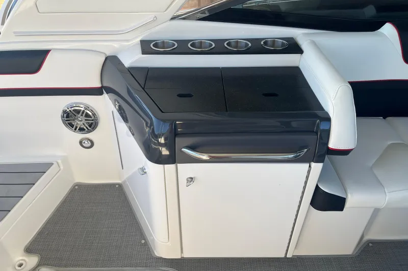 Slide: The Image of 2021 Formula 310 Bowrider I/O interior with sleek seating and cup holders. - 16