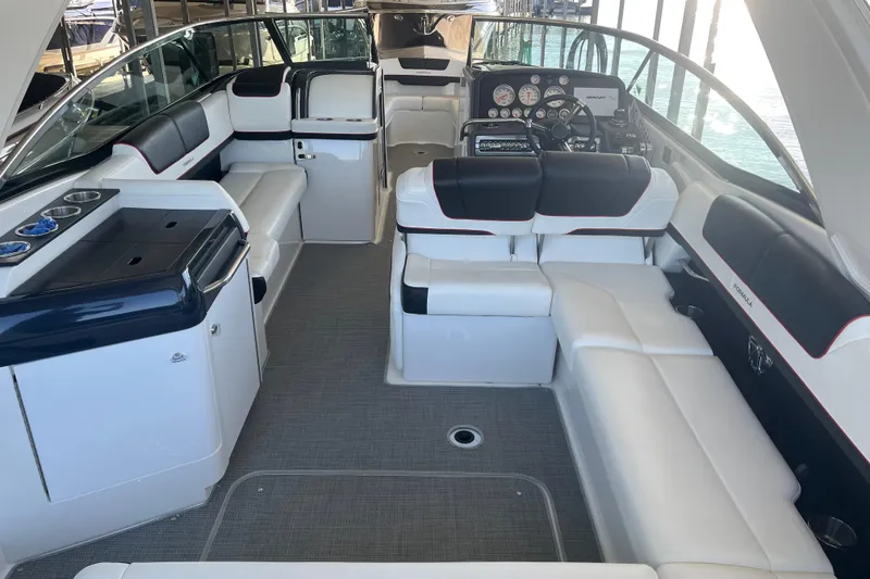 Slide: The Image of 2021 Formula 310 Bowrider I/O interior with luxurious seating and modern dashboard. - 17