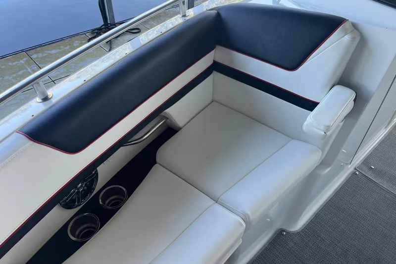 Slide: The Image of 2021 Formula 310 Bowrider I/O interior seating with cup holders and armrest. - 4
