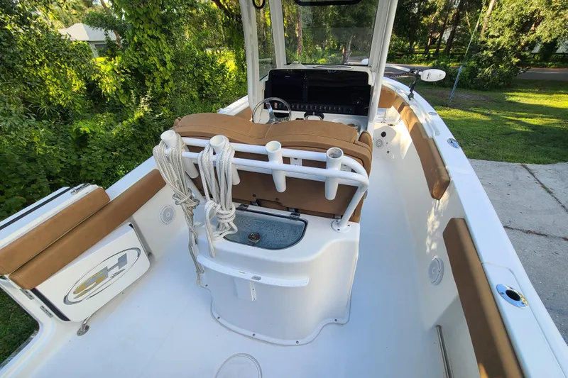 Slide: The Image of 2018 Sea Hunt Gamefish 25 boat interior with seating and steering console. - 23