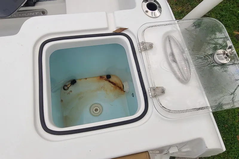 Slide: The Image of Open storage compartment on 2018 Sea Hunt Gamefish 25 boat, showing interior details. - 30