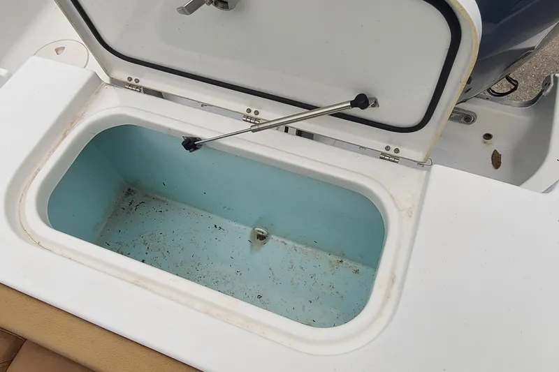 Slide: The Image of Open storage compartment on 2018 Sea Hunt Gamefish 25 boat, showing interior details. - 31