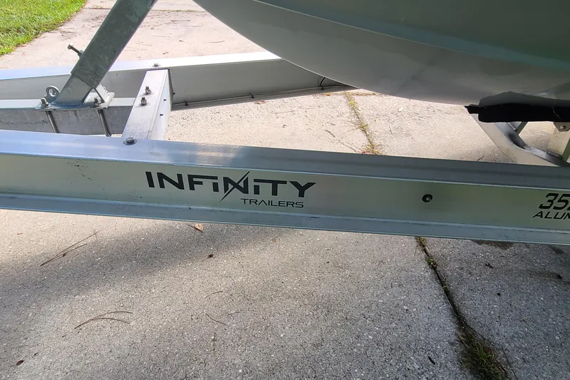 Slide: The Image of Infinity Trailers logo on a boat trailer for 2018 Sea Hunt Gamefish 25. - 47