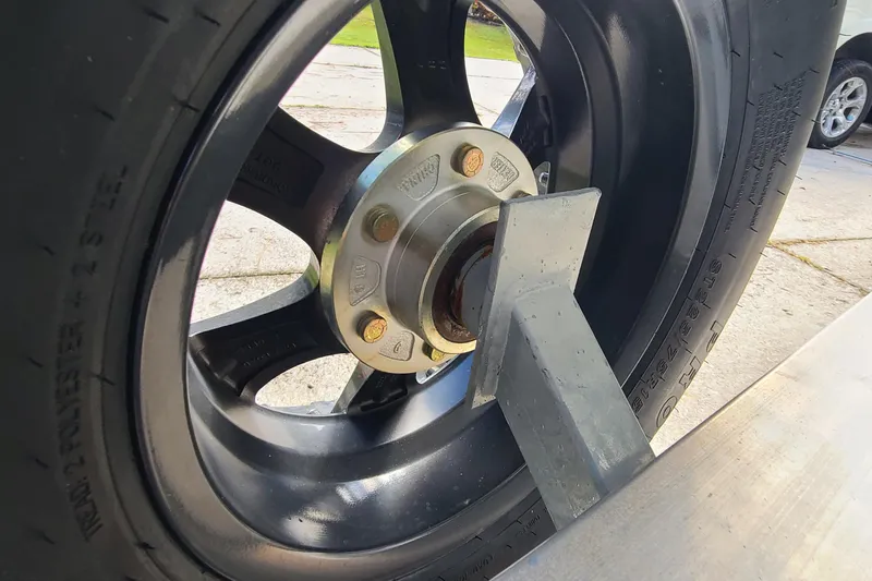 Slide: The Image of Close-up of a 2018 Sea Hunt Gamefish 25 trailer wheel and hub assembly. - 48