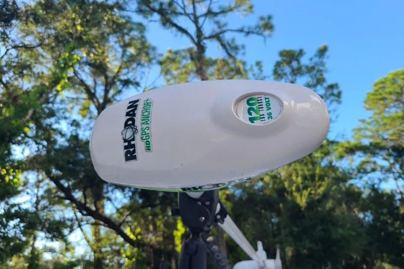 Slide: The Image of Rhodan HD GPS Anchor on 2018 Sea Hunt Gamefish 25, surrounded by lush trees. - 8